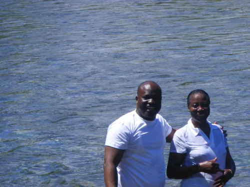 A man and woman conducting baptism